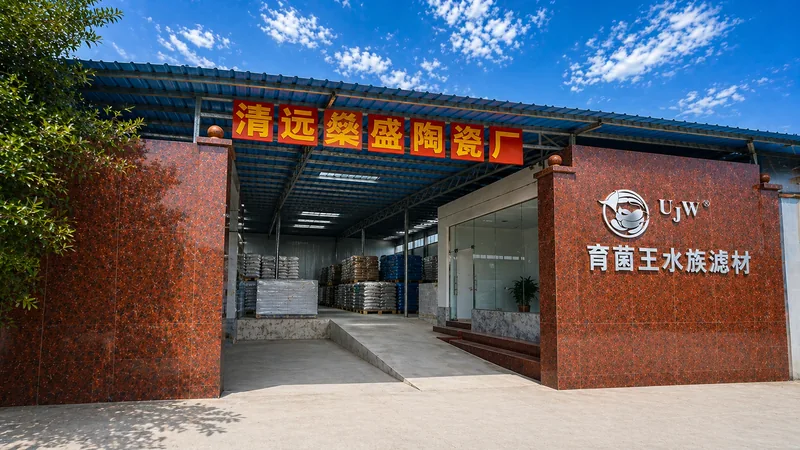 UJW factory entrance with warehouse visible behind the gate