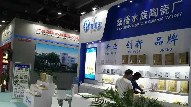 UJW trade show booth displaying boxed and bagged filter media